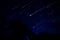 Meteor shower in night sky