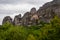 Meteora - Hiking trail through the forests near tourist village Kastraki on a mystical cloudy day in Kalambaka, Meteora