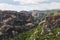 Meteora Monasteries Greece , valley and monasteries surrounded by dark cliffs