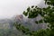 Meteora - Scenic view of  Holy Monastery of St Nicholas Anapafsas seen from forest on cloudy day, Kalambaka, Meteora