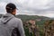 Meteora - Selected focus on man with panoramic view of Holy Monastery of Varlaam, Kalambaka, Meteora,