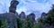 Meteora - Silhouette of man standing next to a massive rock formation near village Kastraki, Meteora, Greece