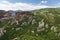 Meteora valley and monasteries surrounded by dark cliffs