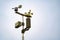 Meterological weather station wind meter anemometer on sky background