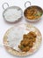 Methi chicken meal with serving bowls