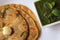 Methi paratha topped with ghee