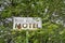 Methow, Washington - July 5, 2019: Old abandoned sign for the former Wagon Wheel Cafe and motel, closed for many years, along the