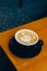 A meticulously crafted latte with heart-shaped latte art, inviting a warm coffee experience.