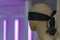 Metoo blindfolded woman mannequin on aids purple background