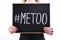 ` METOO` text in woman`s hands. Female empowering movement concept.