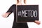 ` METOO` text in woman`s hands. Female empowering movement concept.