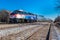 Metra locomotive pulls commuter train