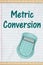 Metric conversion message with a calculator on lined paper