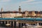 Metro trains passing on the bridge with the Old Town facades in the background