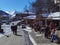 Metsovo city people walking and sitting to shop for coffee snow on the roofs and ice