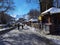 Metsovo city people walking and sitting to shop for coffee snow on the roofs and ice