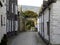 Mews cottages leading to a churchyard.