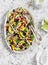 Mexican black bean salad. Salad with corn, beans, avocado and tortilla.