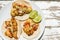 Mexican breaded shrimp tacos with sauce and lime