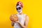 Mexican Catrina, portrait of young latin woman holding mexican hojaldra traditional bread, Halloween party in Mexico