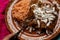 Mexican chicken enchiladas with mole sauce and rice on pink background