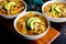 Mexican Chicken Lime Soup Garnished with Avocado and Tortilla Chips