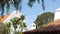 Mexican colonial style suburban, hispanic house exterior, green lush garden, San Diego, California USA. Mediterranean terracotta