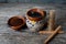 Mexican cup of coffee with cinnamon on wooden background