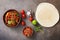 Mexican dish fajitas meat with vegetables and salsa sauce on a dark rustic background. Flat lay, overhead