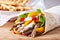 Mexican fajita, wrap made of tortilla, beef, fresh vegetables.