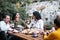 Mexican family eating Rosca de Reyes or Epiphany cake, Roscon de reyes with traditional mexican chocolate cup in Mexico