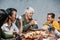 Mexican family eating Rosca de Reyes or Epiphany cake, Roscon de reyes with traditional mexican chocolate cup in Mexico