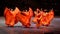 Mexican female dancers in orange dress