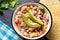 Mexican fish  ceviche with avocado on dark background