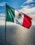 Mexican flag waving in the wind isolated Mexico