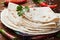 Mexican flatbread tortilla on wooden board