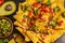 Mexican food concept. Nachos - yellow corn totopos chips with gu