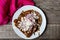 Mexican food: Mole sauce enchiladas with cream and fresh cheese