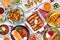 Mexican food table scene. Overhead view on a white wood background.