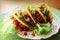 Mexican food - tacos with meat, lettuce and tomatoes