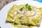 Mexican green enchiladas with melted cheese also called Suizas