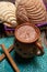 Mexican hot chocolate with sweet conchas bread on wooden background