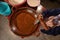 Mexican indigenous woman preparing Mole on a clay pot