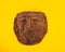 Mexican Mayan Aztec wood and ceramic mask on yellow background travel image Mexico Tenochtitlan, Teotihuacan