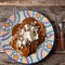 Mexican mole sauce enchiladas with cheese and sesame seeds