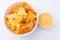 Mexican nachos with creamy cheese sauce. Delicious salty corn chips triangular nachos snack for party