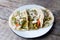 Mexican nopal cactus  tacos with cheese on wooden background