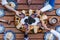 Mexican people eating Rosca de reyes or Epiphany cake, Roscon de reyes with traditional mexican chocolate cup in Mexico top view