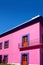 Mexican pink house facade wooden doors