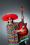 The mexican playing guitar wearing sombrero